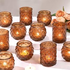 a group of candles sitting on top of a table