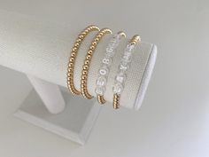 one name bracelet made with 4mm 14k gold plated beads bracelets are made on a durable stretch elastic cord please refer to our sizing guide before purchasing Bracelets Name, Gold Beaded Bracelets, Name Bracelets, Multiple Bracelets, Bracelets Beaded, Stacking Bracelets, Word Bracelet, Gold Plated Bracelet, Letter Bracelet