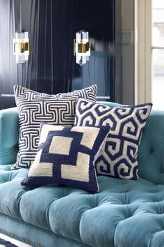 a blue couch with some pillows on it