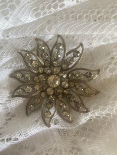 A very old vintage brooch with rhinestones!  A beautiful piece! All there and in pretty good shape! This was from my Grandmothers collection!  Maybe from the 50s or 60s Vintage Rhinestone Brooches For Party, Vintage Rhinestone Party Brooches, Vintage Rhinestone Brooches For Vintage Events, Vintage Rhinestone Brooches For Evening, Vintage Evening Brooches With Rhinestones, Vintage Sparkling Brooches For Formal Wear, Vintage Sparkling Brooches For Formal Occasions, Vintage Sparkling Brooch For Formal Occasions, Vintage Anniversary Brooch With Sparkling Stones