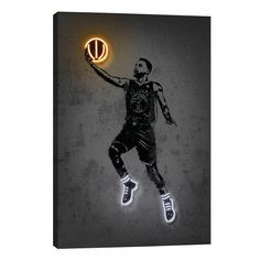 a basketball player is holding the ball in his hand with neon lights on it, as if