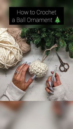 someone is crocheting a ball ornament with scissors