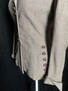 "Late 40's/early 50's gray brown Dan Millstein super pleated blazer with rows of buttons. Discolored red lining, interior collar staining, and one smaller stain on a cuff. All shown in photos Women's small/medium 36\" bust 27\" waist 26\" shoulder to hem 14.5\" back shoulders" Fitted Brown Sport Coat With Buttons, Vintage Blazer With Hidden Button Closure For Formal Occasions, Vintage Blazer With Covered Buttons For Formal Occasions, Vintage Blazer With Hidden Button Closure For Formal Events, Fitted Vintage Sport Coat For Work, Elegant Brown Blazer With Button Cuffs, Fitted Sport Coat With Button Cuffs For Office, Vintage Single Button Blazer For Office, Vintage Fitted Office Blazer