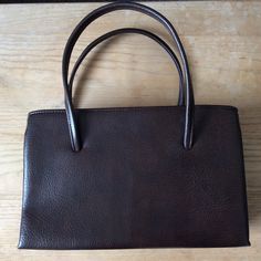 Vintage large frame handbag, late 60s/1970s. Dark brown  pvc faux leather handbag with two top handles, gilt tone metal frame, attractive top catch, gusseted sides. Clean fabric lining. Large main section with inside metal zipped side pocket. to each side of the main frame are additional top metal zipped sections, I.e, front and back. In good vintage condition, slight tarnish to the frame, (see photos), perfect with any 60s 70s outfit.  W 13 ins 33 cm  H 8 ins 20 cm  D 4 ins 10 cm  H from base t Classic Brown Evening Bag With Top Handle, Brown Leather Tote Evening Bag, Classic Brown Box Bag With Handle Drop, Brown Evening Bag With Handles For Everyday Use, Brown Formal Evening Bag With Top Carry Handle, Brown Formal Evening Bag With Top Handle, Brown Evening Bag For Everyday Use, Formal Brown Evening Bag With Top Carry Handle, Vintage Brown Box Bag With Removable Pouch