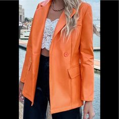 Orange Casual Single-breasted Faux Leather Outerwear, Spring Faux Leather Blazer With Button Closure, Spring Faux Leather Jacket With Button Closure, Spring Chic Leather Jacket With Button Closure, Chic Solid Leather Jacket With Pockets, Chic Spring Leather Jacket With Button Closure, Spring Fitted Faux Leather Blazer, Fitted Faux Leather Blazer For Fall, Spring Faux Leather Single Breasted Jacket