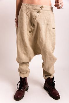 Update your streetwear with the linen harem pants women. These Foll Loose fitting pants women feature a low waisted construction, front asymmetric button closure. The pants have two side pockets for convenient storage. This linen clothing is designed to flatter every body type and fit numerous occasions. When we designed thes harem pants we focus on the versatility of each model to make it a perfect match for your favorite accessories and wardrobe pieces. Perfect for slaying in the streets, pair Baggy Beige Linen Harem Pants, Beige Baggy Linen Harem Pants, Beige Linen Bottoms With Buttons, Relaxed Fit Linen Pants With Buttons, Casual Pants Women, Summer Linen Pants, Linen Harem Pants, Casual Linen Pants, Loose Fitting Pants