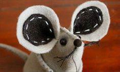 a close up of a stuffed animal mouse