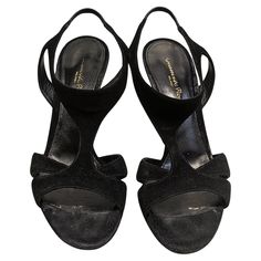 Black velvet sandals with open toe and crossed straps. Made In: Italy Color: Black Material: Velvet Marked Size: 38 Europe Heel Height: 11,5 cm/ 4,53 inches To introduce you to the figure of Gianvito Rossi we could start with the proverb that says that 'caste comes to the greyhound', so at a glance you would find out that he belongs to a saga of great shoemakers 'made in Italy'. His father was Sergio Rossi, a master expert in footwear who left us last April at the age of 85 due to the coronaviru Adjustable Straps Open Toe Heels, Wrapped Heel Open Toe Sandals For Night Out, Open Toe Sandals With Wrapped Heel For Night Out, Night Out Open Toe Sandals With Wrapped Heel, Evening Sandals With Wrapped Heel And Open Toe, Black T-strap Sandals With Buckle For Party, Adjustable Straps Open Toe Sandals, Evening Slingback Sandals With Open Toe, Open Toe Slingback Sandals For Evening