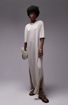 Made from supple jersey, this flowy maxi dress is simply styled so you can show off your accessories or keep it minimalist. Crewneck Elbow-length sleeves Side-seam pockets Side slits 100% polyester Machine wash, line dry Imported Beige Maxi Dress With Side Slits, Chic Relaxed Fit Maxi Dress, Chic Beige Maxi Dress With Side Slits, Spring Evening Maxi Dress In Longline Style, Spring Evening Longline Maxi Dress, Spring Neutral Maxi Dress, Short Sleeve Maxi Dress With Side Slits For Daywear, Beige Relaxed Fit Maxi Dress, Elegant Oversized Short Sleeve Maxi Dress