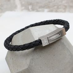 Super stylish sueded leather bracelet engraved with the lucky recipients initials and your secret message on the back of the clasp. The perfect personalised gift This contemporary men's bracelet is personalised with your choice of initials and secret message to create a treasured gift Dates, names and special words on this beautiful bracelet will create a present that shows you really care. This smart bracelet is made of sueded leather with an easy to use stainless steel clasp. Available in two Men Suede, Smart Bracelet, Photo Bracelet