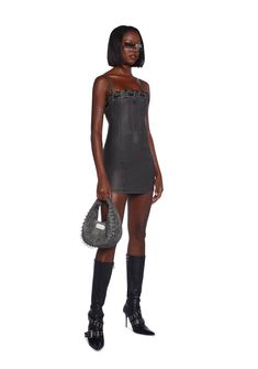 This fully lined mini dress has a matte vegan leather construction, structured boning on the front and back, side slits, a lace-up design at the neckline, adjustable shoulder straps, and a back zipper closure. Black Mini Dress With Spaghetti Straps And Strap Detailing, Fitted Black Mini Dress With Strap Detailing, Sleeveless Sleek Leather Mini Dress, Black Mini Dress With Spaghetti Straps, Gothic Mini Length Bodycon Dress For Evening, Gothic Bodycon Mini Dress For Evening, Black Mini Dress With Strap Detailing For Party, Black Mini Corset Dress With Lace-up Back, Chic Mini Dress With Adjustable Straps For Night Out