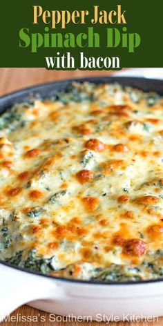 a casserole dish with spinach and cheese in it on a wooden table