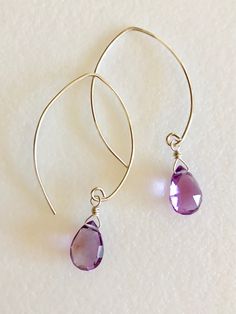 "Lovely genuine amethyst pear drops in Rose de France lilac pink color. Wrapped in Sterling silver on handmade earrings in simple modern design. Luxe AAA faceted gemstones are 11 x 8 mm. Total drop length is 1 7/8\". Also available in 14k gold fill. Beautiful spring color!" Purple Teardrop Wire-wrapped Earrings, Lavender Teardrop Jewelry With Ear Wire, Purple Teardrop Wire Wrapped Earrings, Purple Gemstone Teardrop Earrings, Handmade Amethyst Teardrop Earrings, Lavender Teardrop Nickel-free Jewelry, Lavender Teardrop Earrings With Ear Wire, Adjustable Teardrop Amethyst Earrings, Pear-shaped Amethyst Jewelry As Gift