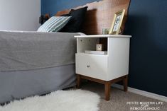 a bedroom with blue walls and white carpet