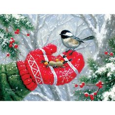 a bird sitting on top of a red mitt next to a tree filled with berries