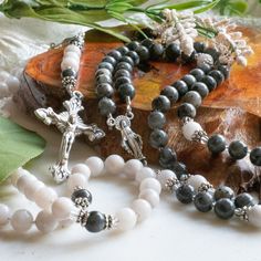 "A beautiful pair of rosaries symbolizing the two becoming one flesh through the sacrament of matrimony. The perfect gift for a bride and groom, or for an anniversary gift! Genuine stone beads add a weight and gravitas to the rosary that makes it totally unique from most other rosaries THIS LISTING IS FOR THE PAIR OF ROSARIES, not sold individually. ---- \"Sacred Scripture begins with the creation of man and woman in the image and likeness of God and concludes with a vision of \"the wedding-feast of the Lamb.\" Scripture speaks throughout of marriage and its \"mystery,\" its institution and the meaning God has given it, its origin and its end, its various realizations throughout the history of salvation, the difficulties arising from sin and its renewal \"in the Lord\" in the New Covenant Sacrament Of Matrimony, Creation Of Man, Wedding Feast, Sacred Scripture, Catholic Wedding, Crimp Beads, The Rosary, Beading Wire, Crazy Lace Agate