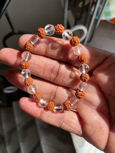 This is Beautifully Designed Bracelet in Natural Clear Crystal Quartz And Rudraksha  Round Shape Uses - Perfect For Your Loved Ones , Perfect Gift ,Etc... Delivery details: ✓ Free Shipping    With safe Packing ✓   Your most welcome Here ❤️ We Design Our All Products in Natural Stones With Perfections And Artmanship Our all Products Are Purely HandCarved with Hand Machine tools Feel Free To  Ask Any Query of Yours We Definitely Reply With our Best ❤️ -                                                                                                           Shyam Gem Carvings Thanks for visiting the shop have a nice day Shyam Gem Carvings ✓ Spiritual Faceted Bead Bracelet, Spiritual Bracelets With Faceted Round Beads, Spiritual Healing Crystal Bracelet With Spacer Beads, Meditation Beaded Bracelet With Faceted Beads, Meditation Beaded Bracelets With Faceted Beads, Fusion Style Beaded Bracelets As Gift, White Spiritual Bracelets For Festivals, Spiritual White Bracelets For Festivals, Spiritual Round Beaded Bracelets With Polished Beads