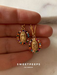 Product Details + Care - Pendant is 18K Gold Filled, Copper - Chain is gold plated over brass. - Cubic Zirconia Stones- 1 Necklace Only - Wipe Clean - Imported Each rainbow color differs in pattern and is unique. Dimensions - Pendant: 0.75" x 0.75" - Chain Length: 17.5" Have a question? Please message info@shopsweetpeeps.com and our support team will get back to you in 48 hours. Mary Necklace, Saint Mary, Rainbow Color, Copper Chain, Gold Dipped, Colourful Necklace, Oils For Skin, Support Team, Ring Bracelet