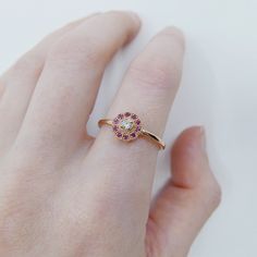 Flora Ruby ring, Gold Ruby flower ring, 14k gold ruby and diamond cluster ring, alternative engagement ring Flower Ring With Rose Cut Diamonds For Gifts, Dainty Ruby Ring With Round Cut, Gemstone Flower Ring For Promise, Rose Gold Ruby Ring With Halo Setting For Promise, Fine Jewelry Ruby Cluster Ring With Halo Design, Fine Ruby Cluster Ring With Halo Design, Ruby Birthstone Promise Ring With Rose Cut Diamonds, Dainty Ruby Ring With Rose Cut Diamonds For Promise, Rose Gold Ruby Ring With Halo