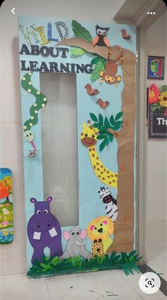 an animal themed classroom door with the words about learning written on it and pictures of animals