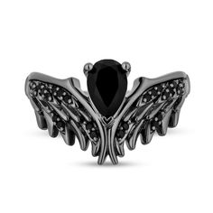 Plan to stand out while wearing this pear-shaped black onyx and black diamond wings ring from the Enchanted Disney Fine Jewelry Villains Collection inspired by Maleficent. Created in sterling silver with black rhodium plate Alluring black diamonds and sculpted feather details shine along a pair of wings that meet in a chevron-shaped design. An 8.0 x 5.0mm pear-shaped rich black onyx glistens at the center of the contour while crown insets along the shank are the final detail. Captivating with 1/5 ct. t.w. of diamonds This ring is available in size 7 only and cannot be resized after purchase. ©Disney Maleficent Ring, Disney Engagement Rings, Wings Ring, Maleficent Costume, Enchanted Jewelry, Enchanted Disney, Enchanted Disney Fine Jewelry, Disney Fine Jewelry, Black Stone Ring