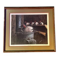 a framed photograph of chickens in a bucket