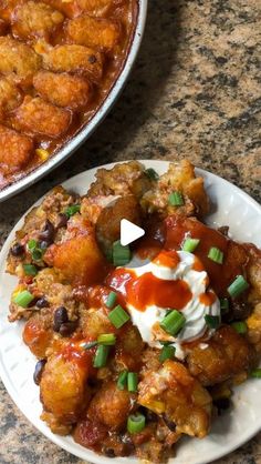 two white plates topped with food next to a casserole dish