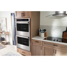 a kitchen with two ovens in it