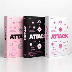 three books with different designs on them, one is pink and the other is black