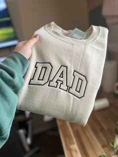 This is the perfect sweatshirt to make your mans wear on father's day! It's super simple and is giving all the neutral vibes so many guys love. Pictured here is the Jerzees Traditional Sweatshirt in Sandstone with a black thread. All sweatshirts are unisex sizing and fairly true to size. We do suggest to go up a size if you prefer an oversized extra comfy fit. We do recommend to wash on cold and dry on low heat to prevent any shrinkage. If you need your item by any particular date please email o Neutral Vibes, Comfort Colors Sweatshirt, Black Thread, Go Up, Comfort Color, Your Man, Sweatshirt Designs, Comfy Fits, Apparel Design