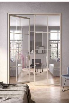 an open glass sliding door in a bedroom