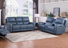 a living room filled with blue leather furniture