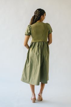 Stay cool and chic in The Fanelli Knit Bodice Midi Dress. This unique dress features a playful olive color and a comfortable knit bodice. Perfect for any occasion, it's sure to make a statement (and keep you comfortable!) all day long. Don't miss out on this quirky and stylish addition to your wardrobe! Details self: 60% cotton + 40% polyester lining: 52% viscose + 26% polyester + 22% nylon Fabric Care Guide Here Sizing & Fit Measurements are approximate and taken while laying flat across the fr Chic Green Knit Midi Dress, Green Knit Midi Dress For Spring, Casual Khaki Cotton Dress, Knee-length Khaki Dress For Fall, Khaki Knee-length Dress For Fall, Khaki Knee-length Fall Dress, Casual Knee-length Khaki Dress, Casual Khaki Knee-length Dress, Olive Fitted Knee-length Dress