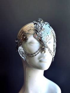 Step into the realm of goddesses with our women's masquerade mask in silver. Rhinestones delicately embellish the mask, adding a touch of sparkle. Silver chains gracefully adorn the mask, creating an enchanting movement. Capture attention at any masquerade party, ball, or themed event!


Age Group/Gender - Adult/Women

Size/Type - One size fits all adults

Mask Color - Silver

Mask Material - Laser Cut Metal

Special Features - Chains and rhinestones Angel Masquerade Mask, Moon Masquerade Mask, Masquarade Mask, Clear Dress, Masquerade Ball Costume, Labyrinth Ball, Masquerade Mask Black, Elegant Face Mask, Mask Venetian