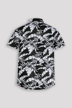 This short-sleeve button-up shirt features a sleek tropical leaf pattern in black and white. Perfect for adding a touch of sophistication to any outfit. Made with high-quality materials for a comfortable and stylish look. Boost your wardrobe with this versatile and trendy shirt. 95% Cotton 5% Spandex Machine wash cold, Tumble dry low, Wash with like colors, Do not bleach. Imported B4WS707 Size Chart Size S M L XL XXL Chest (inches) 36.5 - 38.5 38.5 - 40.5 40.5 - 42.5 42.5 - 44.5 44.5 - 46.5 Meas Black Floral Print Shirt For Summer, Black Short Sleeve Shirt With Graphic Print For Vacation, Black Graphic Print Short Sleeve Shirt For Vacation, Black Short Sleeve Shirt With Graphic Print For Summer, Black Camp Shirt With Graphic Print For Vacation, Black Short Sleeve Hawaiian Shirt For Summer, Black Short Sleeve Shirt With Plant Print, Black Button-up Short Sleeve Shirt For Summer, Black Short Sleeve Shirt With Tropical Print