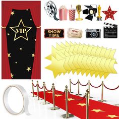 a red carpet with gold stars and white rings on it next to an award display