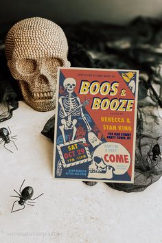 there is a sign that says boos and booze next to some fake skulls