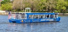 a blue boat with passengers on the water