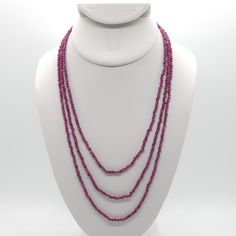 This triple strand necklace is made from all natural all 3mm faceted Natural Ruby done on silk.  It has gold-plated sterling silver and high quality stainless steel findings.  It's finished with a high quality stainless steel magnetic clasp.  The three strands are 17", 19" and 21" with one strand hanging lower than the other. Ruby is a stone of protection and is July's birthstone.  It promotes a positive, outgoing attitude and provides warm energy in darker times.  Ruby is great for uplifting a Multi-strand Crystal Necklaces With Faceted Beads, Multi-strand Crystal Necklace With Faceted Beads, Faceted Multi-strand Necklace As Gift, Faceted Multi-strand Necklace For Gift, Triple Ring, Attitude Positive, Ruby Beads, July Birthstone, Natural Ruby