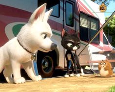 two cats and a dog are standing in front of a bus with another cat on the side