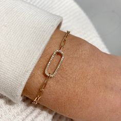 This bracelet is made of 14k gold and 36 white sparkling diamonds totaling .11 cts It's adjustable-so one size fits most! We make every effort to keep this style in stock but sometimes it does sell out! If that happens, please allow up to 8 weeks for us to make this just for you. If you need something by a specific date please do not hesitate to reach out & confirm a ship date with us before ordering: shop@katiediamondjewelry.com. Luxury Dainty Oval Link Bracelets, Diamond Tennis Bracelet With Rectangular Links As A Gift, Diamond Tennis Bracelet With Rectangular Links, Modern Adjustable Diamond Bracelet With Single Cut Diamonds, Rose Gold Tennis Bracelet With Pave Setting As Gift, Elegant 14k Gold Oval Link Diamond Bracelet, 14k Gold Bracelets With Pave Setting For Gift, Diamond Bracelet With Pave Setting For Gift, Diamond Bracelet With Pave Setting As Gift