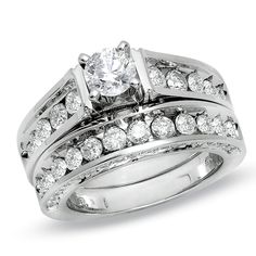 Beauty, brilliance and elegance: what better way to express your love. Channel-set diamonds around the top and outside walls of this wedding band and matching engagement ring provide an unbelievable accent to the 5/8 ct. round diamond center stone you will propose with. This stunning 14K white gold bridal set features magnificent diamonds totaling 3 cts. White Gold Bridal Set, Diamond Tops, Bridal Engagement Rings, Diamond Bridal Sets, Flower Earrings Studs, Bridal Set, Vintage Diamond, Engagement Ring Settings, Bridal Sets