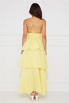 Length from bust to hem of size S: 118cm. Chest: 36cm, Waist: 31cm, across front only of size S. Maxi dress. Lined. Model is a standard XS and is wearing size XS. True to size. Non-stretch. Tiered flowy skirt. Crisscross tie-up back. Elastic back. Zipper. Cold hand wash only. Polyester. Enter the event and impress! The Mysterious Beauty Maxi Dress features an extravagant tiered flowy skirt and a crisscross back tie design. Style with heels and curls for all the attention. Coral Mini Dress, Mysterious Beauty, First Day Outfit, Tie Design, Bridal Shower Dress, Shower Dresses, Jumpsuits And Romper, Dress Yellow, Long Sleeve Lace Dress