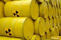 yellow barrels with radioactive symbols on them