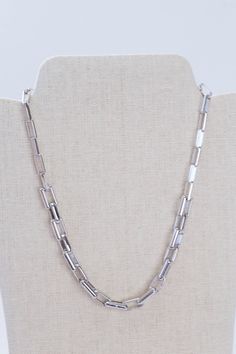 This Rhodium Link Necklace is crafted from silver and features 14" of chain with a secure Claw Clasp Closure for added security. It's the perfect accessory for any occasion. General Info: Fashion jewelry 14" Claw Clasp Closure Imported Silver Link Necklace, Silver Bullet, Link Necklace, Clothing Co, Necklace Silver, Clip Ins, Hair Clip, Hair Clips, Silver Bracelet