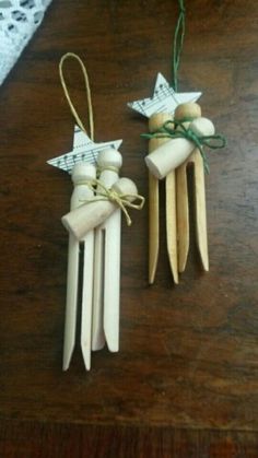 two wooden clothes pins with stars on them