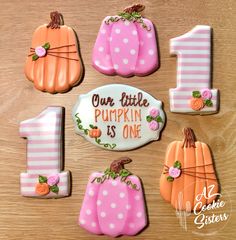 decorated cookies with numbers and pumpkins for first birthday