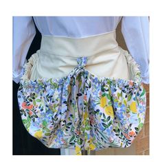 the back of a woman's skirt with flowers on it