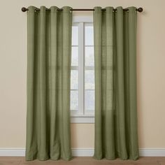 a green curtain hanging in front of a window