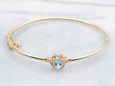 Made from stunning yellow gold, this bracelet features a beautiful oval-cut aquamarine gemstone and a hinged design for easy wear. Perfect for adding a touch of elegance to any outfit. Metal: 14K Yellow Gold Gem: Aquamarine .60 Carats Gem Measurements: 4.8 x 6.9 mm, Oval Inside Circumference: 6 1/2 Inches SKU #: A40052 Each piece has been identified and graded by a Graduate Gemologist who has been certified by the Gemological Institute of America (GIA). We have six brick-and-mortar storefronts i Yellow Gold Bangle, Aquamarine Jewelry, Bracelet Gemstone, Gold Bangle Bracelet, Gold Bangle, Aquamarine Gemstone, Hinged Bangle, Gold Bangles, Gemstone Bracelet